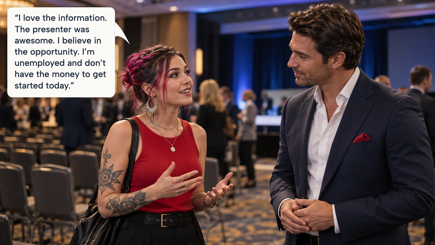 A young woman with pink-streaked hair, statement earrings and arm tattoos talking with a sales representative in a navy suit after the seminar
